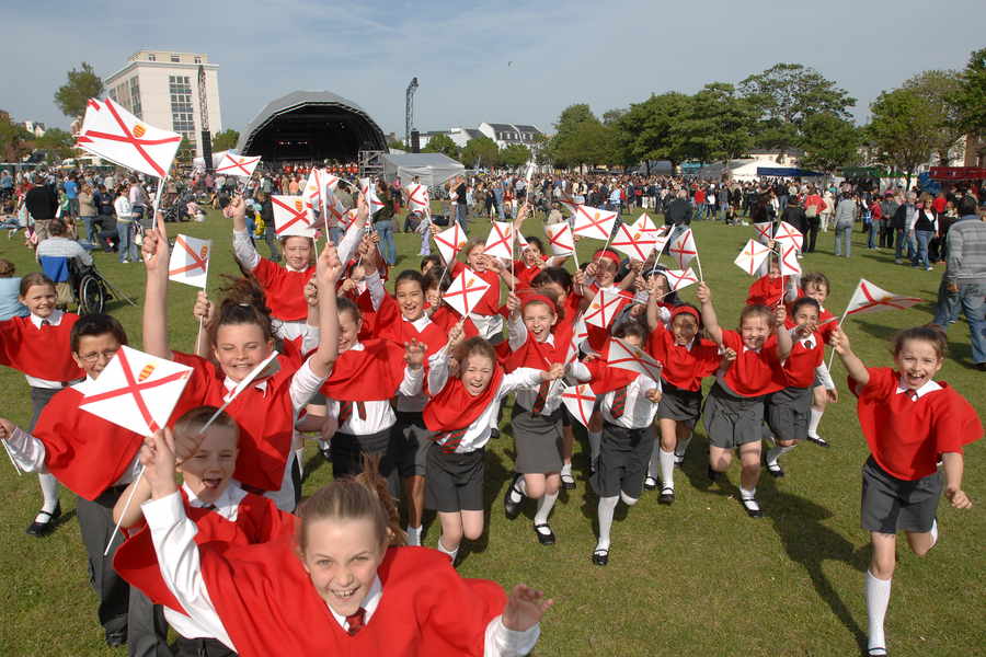 Pupils from Rouge Bouillon School join in the celebrations in the People's Park on Liberation Day in 2007.