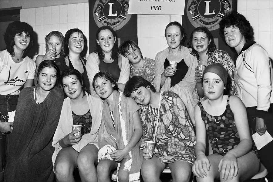 A team relaxes during the 1980 Swimarathon