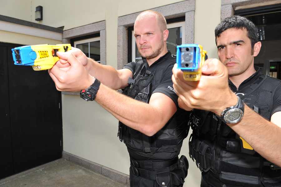PC's Ben Dupre and Celio Abreu with tasers