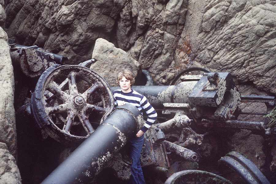 A 16-year-old Tony Pike stands by one of the French 15.5 cm gun carriages at the foot of cliffs at Les Landes in 1979