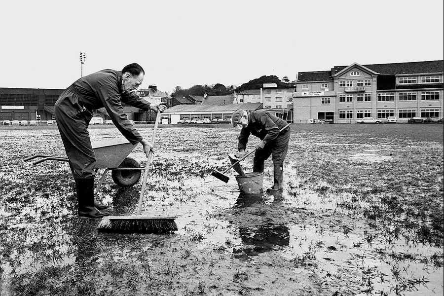 Scenes like this will never be seen at Springfield again. Pictured are Alf Moignard and Jack Bertam trying to dry out a waterlogged Springfield in 1980