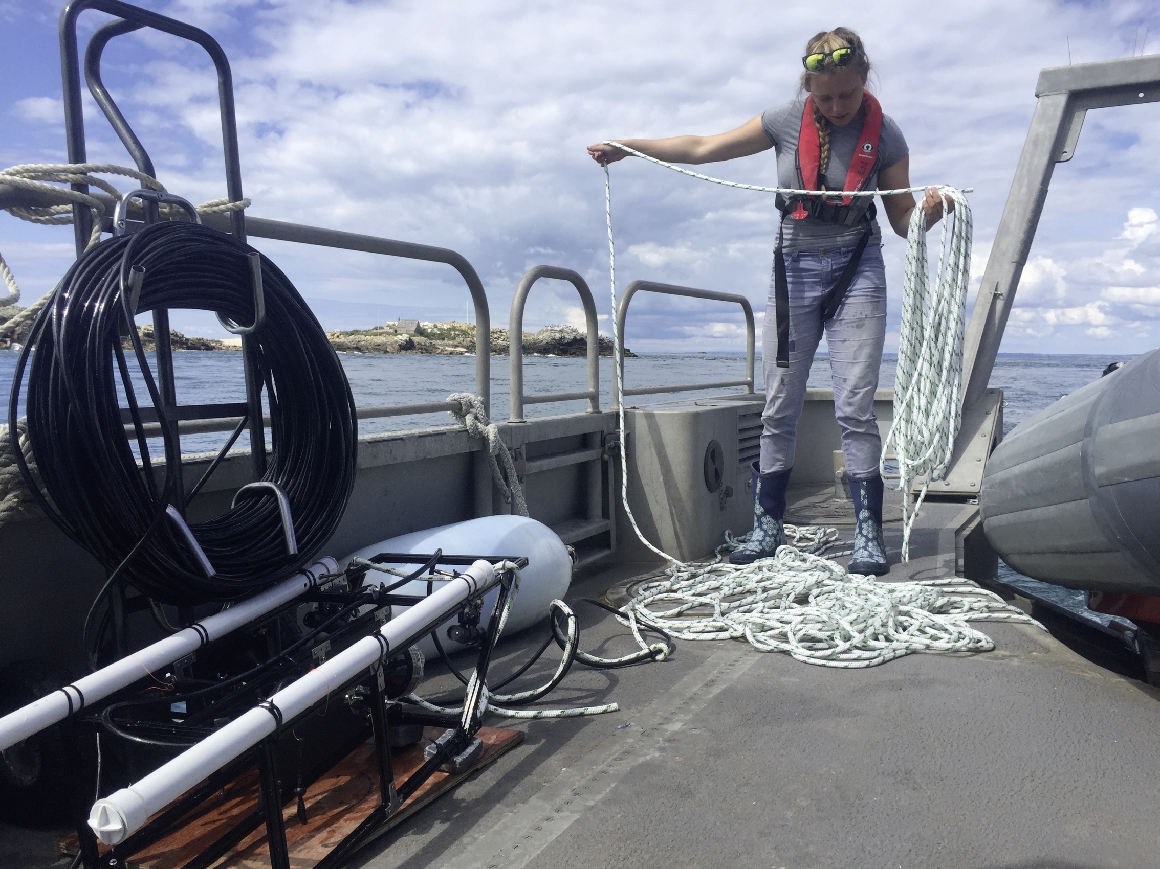 Sam Blampied with camera equipment (left) that is dragged behind the boat (25767862)
