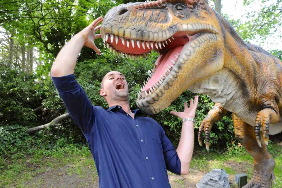 Tamba Park owner Jonathan Ruff with a Tyrannosaurus Rex