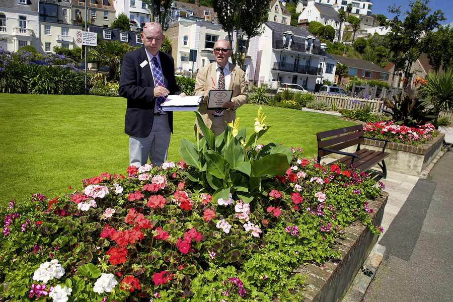 Britain in Bloom judges Glenn Dale (left) and John Wheatly admire a display in St Aubin