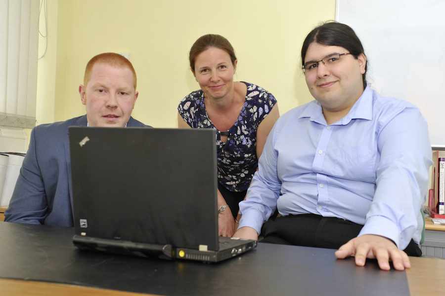 Neil Baal (left), a former mechanic, became an IT and infrastructure specialist with the help of the JET after having his legs amputated because of a genetic anomaly. He is pictured here with operations specialist Nuno Dionisio and JET internships coordinator Amanda Berry