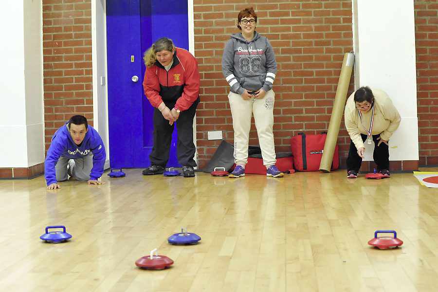 Pierre Brouchard, Janet Vibert, Emma Feldmar and Tina Ware try their hand at curling