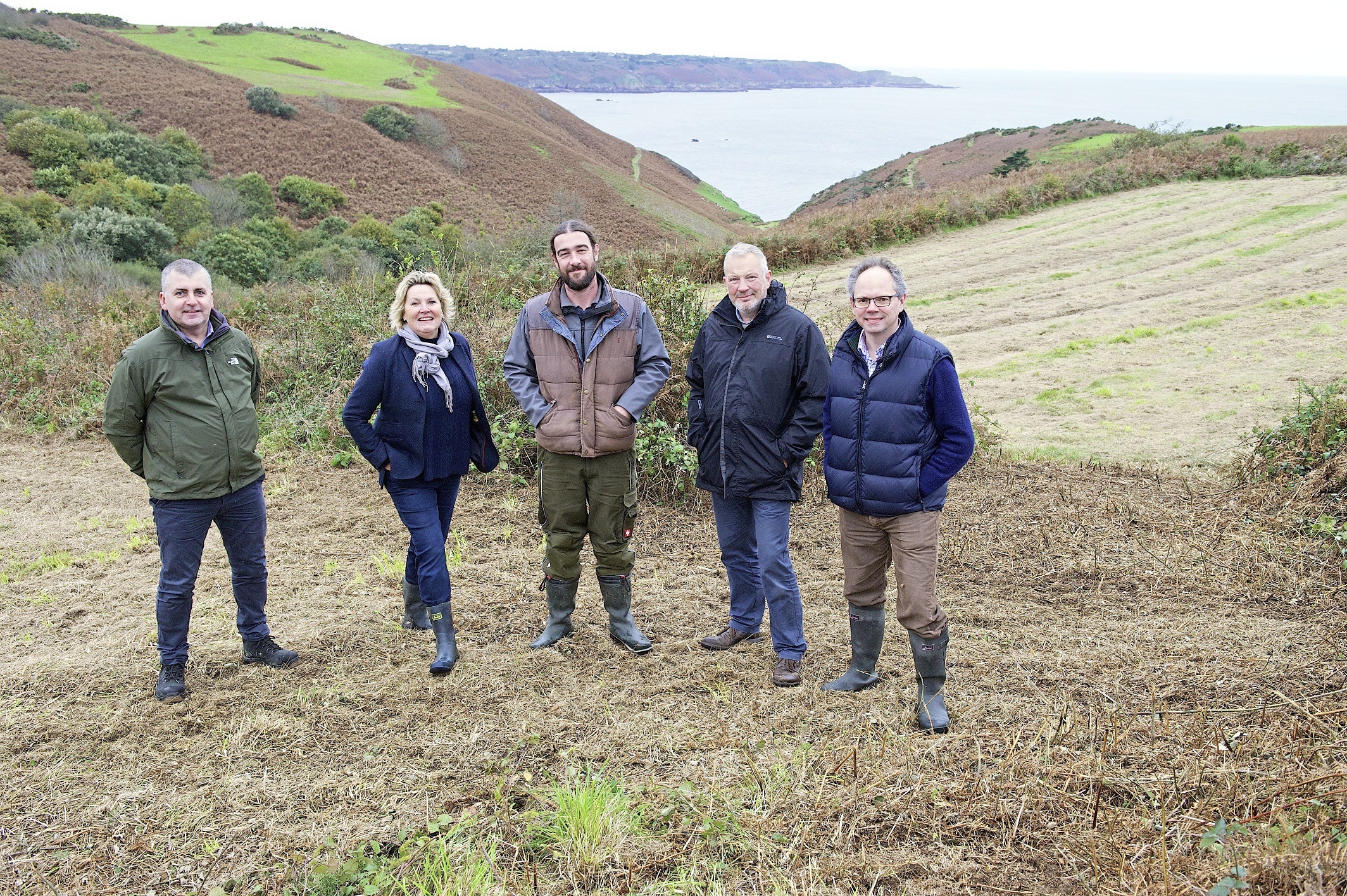 Helier Smith, Jersey Water CEO; Georgina Malet de Carteret, National Trust for Jersey president; Jon Parkes, National Trust for Jersey lands manager; Gerard Farnham, Jersey Trees for Life chairman, and Chris Ambler, Jersey Electricity CEO     Picture: TONY PIKE. (26262387)