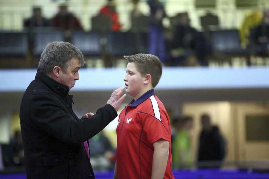 Jordan Wykes gets some coaching tips from his father, Barry