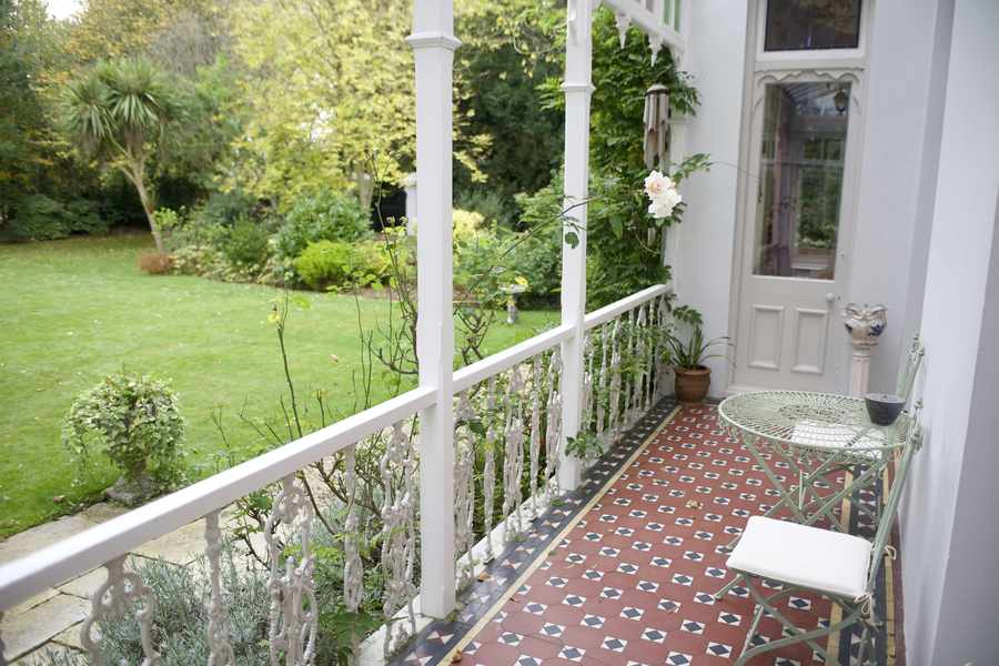 A balcony overlooking the lawn