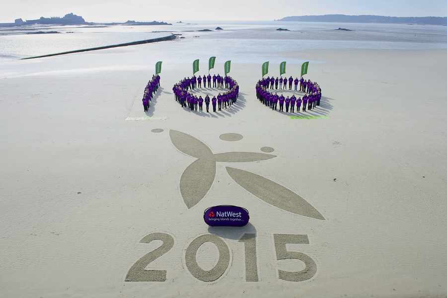 The Waitrose Games Makers form the figure 100 on the beach at West Park – the number of days left until the start of the NatWest Island Games in Jersey this summer
