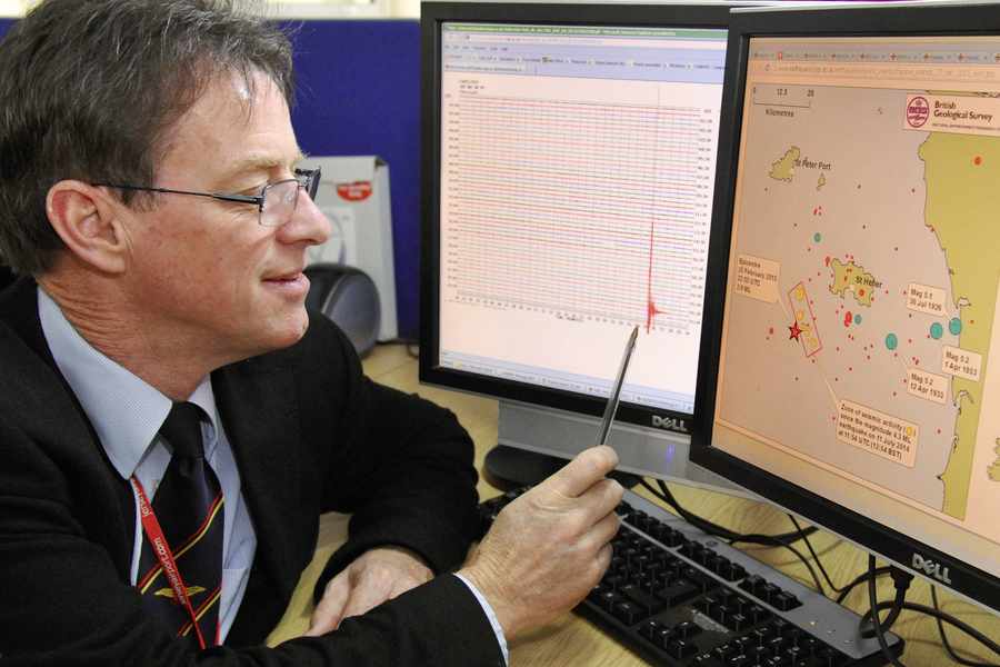 Jersey Met forecaster John Searson examining the data following the tremor.