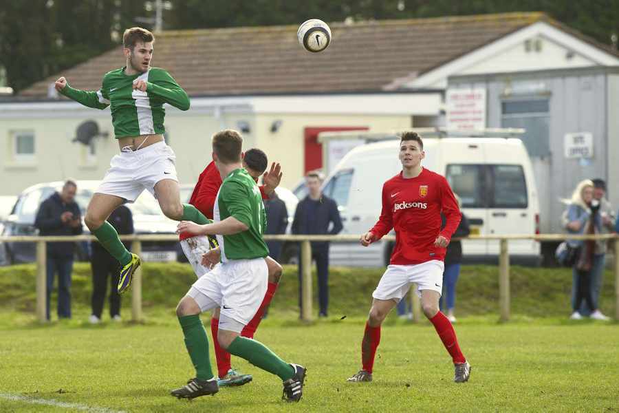 Guernsey's Joe Alvarez jumps above the rest, including Jersey forward Matt Rondel Picture: ROB CURRIE