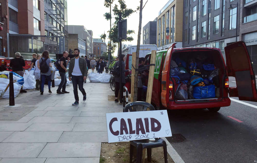 Bags of clothes, blankets, tents and food in Dalston, east London, donated by the public to the charity CalAid