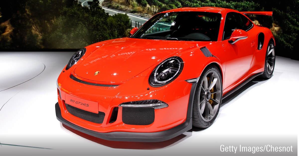 Red Porsche 911 GT3 RS car displayed at Motor Show event.