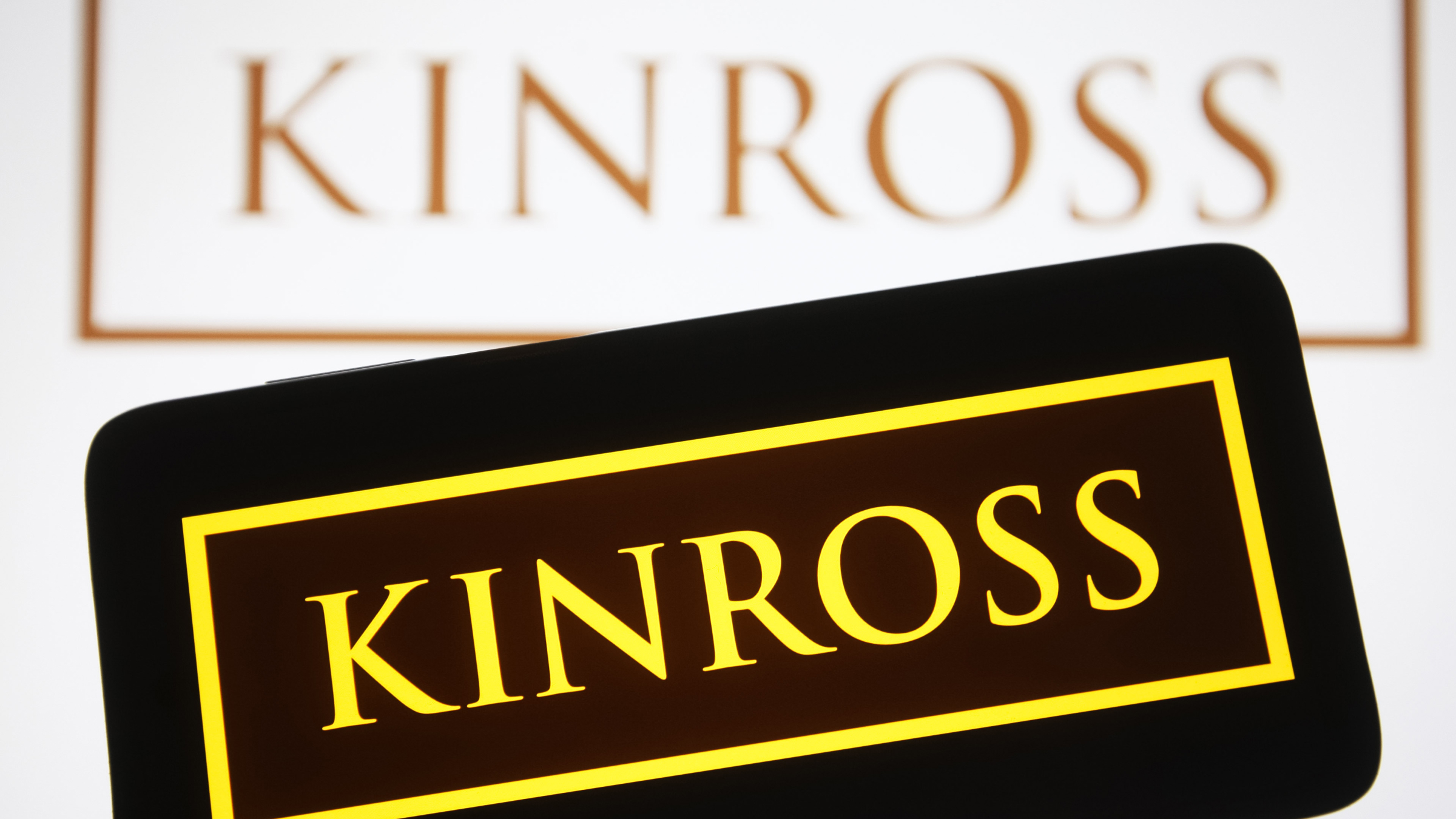 The Kinross Gold Corporation logo is seen on a smartphone.