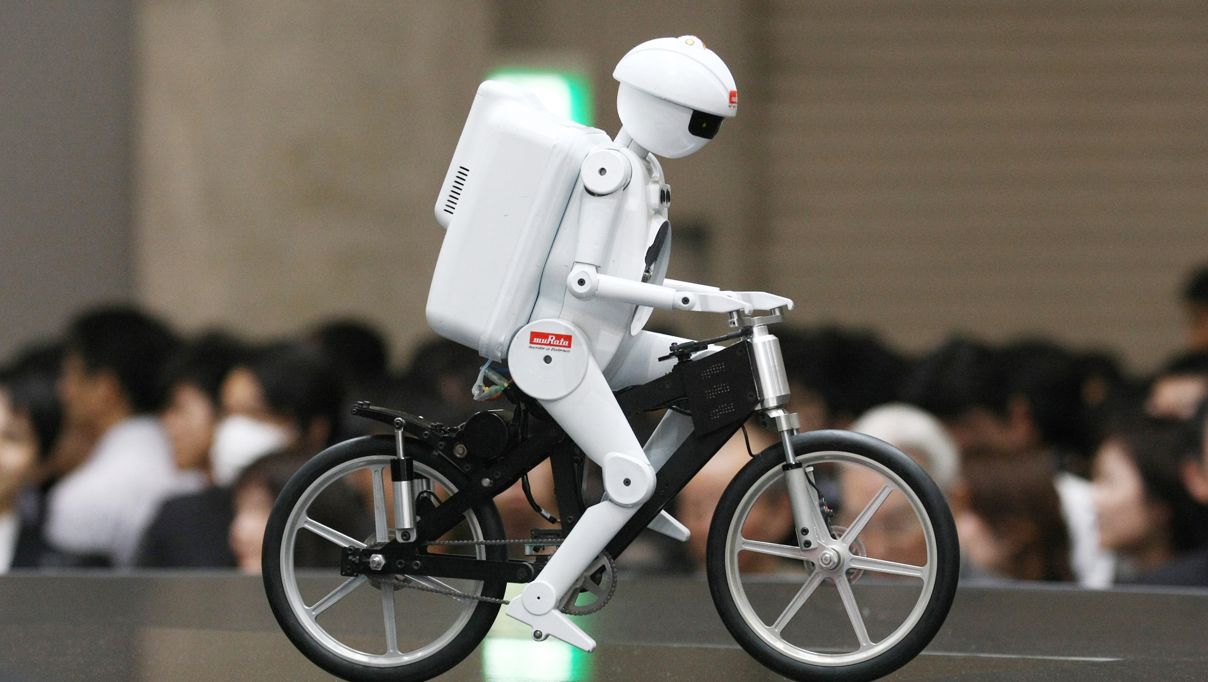 Bicyclist robot 'Murata Seisaku-kun', or Murata Boy, a cycling humanoid robot from Murata Manufacturing Co., Ltd.