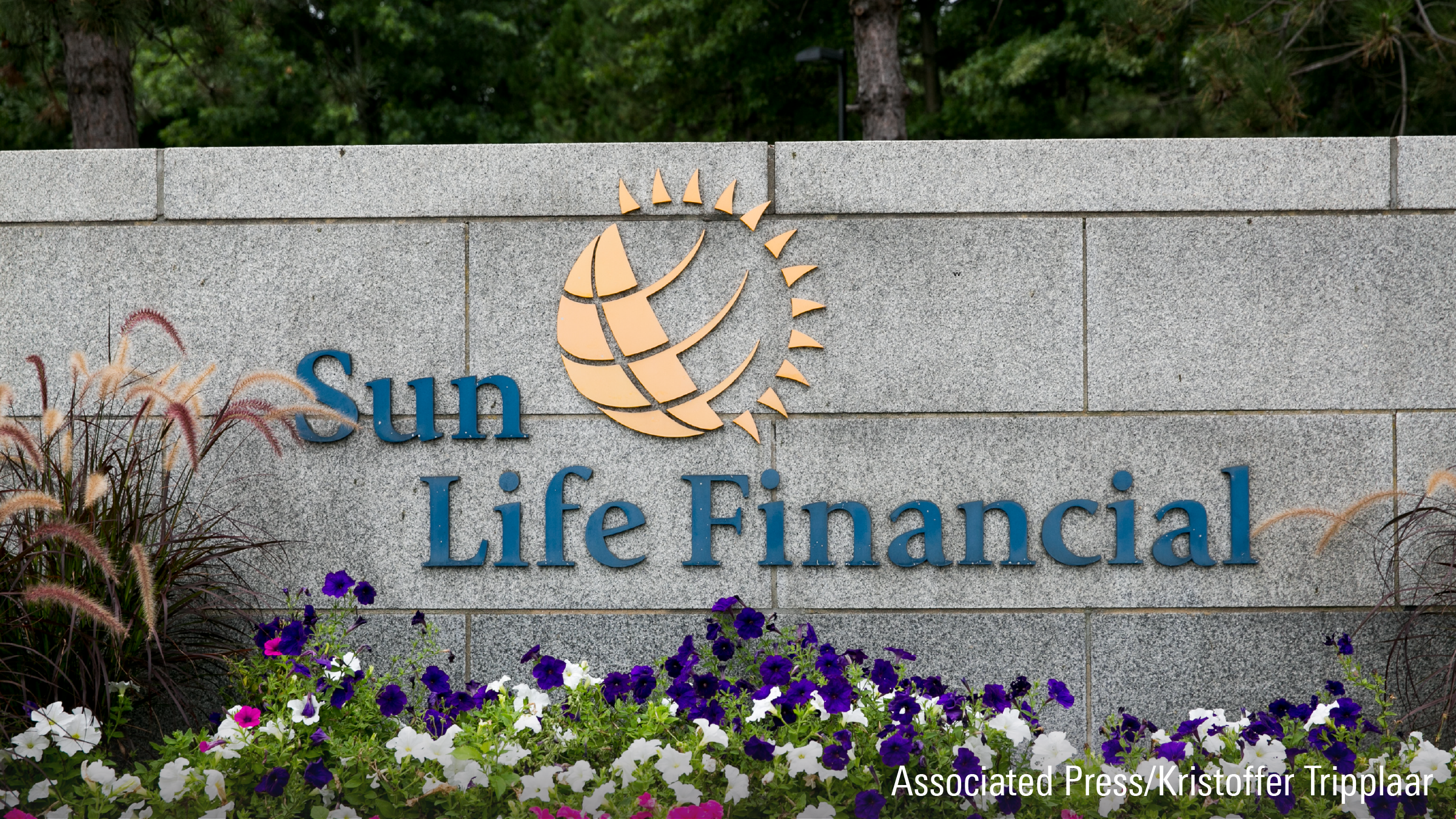 A logo sign outside of a facility occupied by Sun Life Financial, Inc., in Wellesley, Massachusetts.