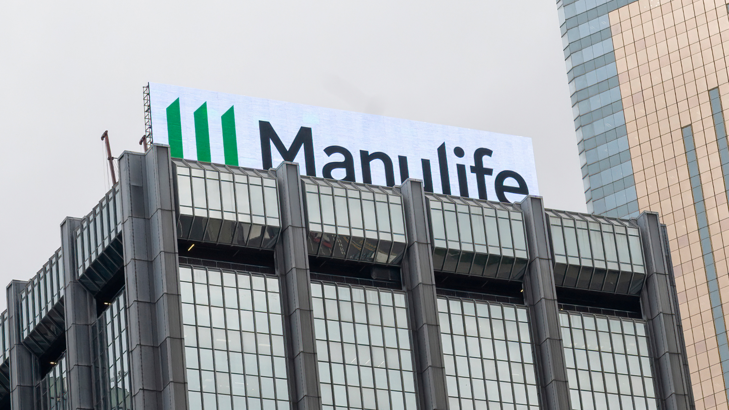 Manulife Financial, logo is seen on top of a building.