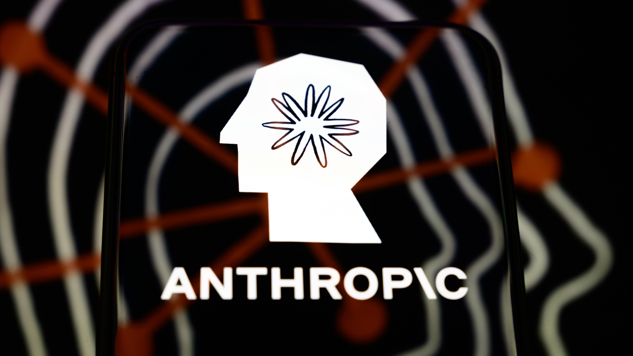 The Anthropic logo is displayed on a smartphone screen.