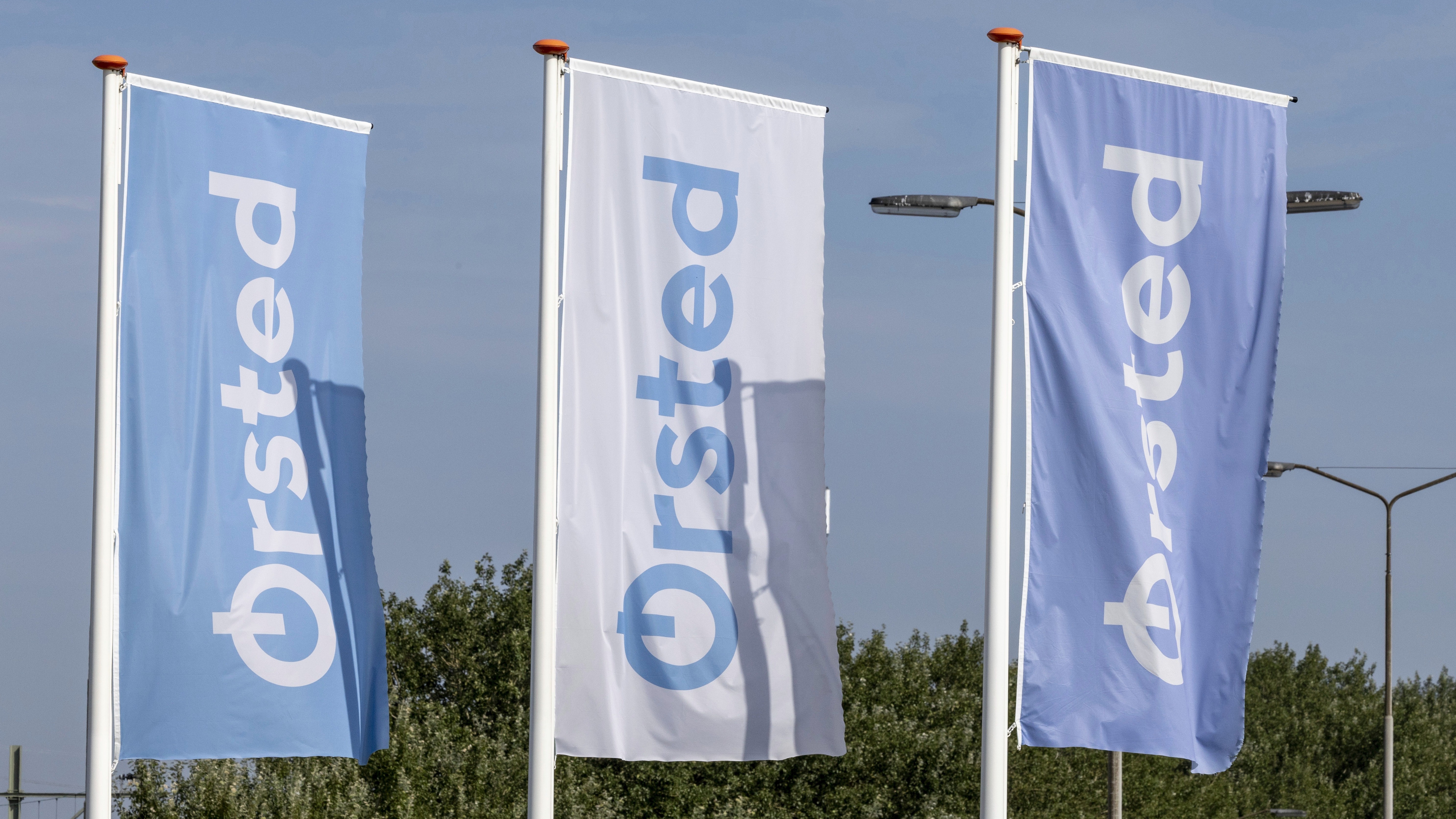 Flags of Orsted are seen during a press moment of Orsted, on Tuesday 06 August 2024, on the transportation of goods with Heavy Lift Cargo Drones to the offshore wind turbines in the Borssele 1 and 2 wind farm in Zeeland, Netherlands. This is a first for the offshore wind sector that such large drones are being used in an offshore wind farm.