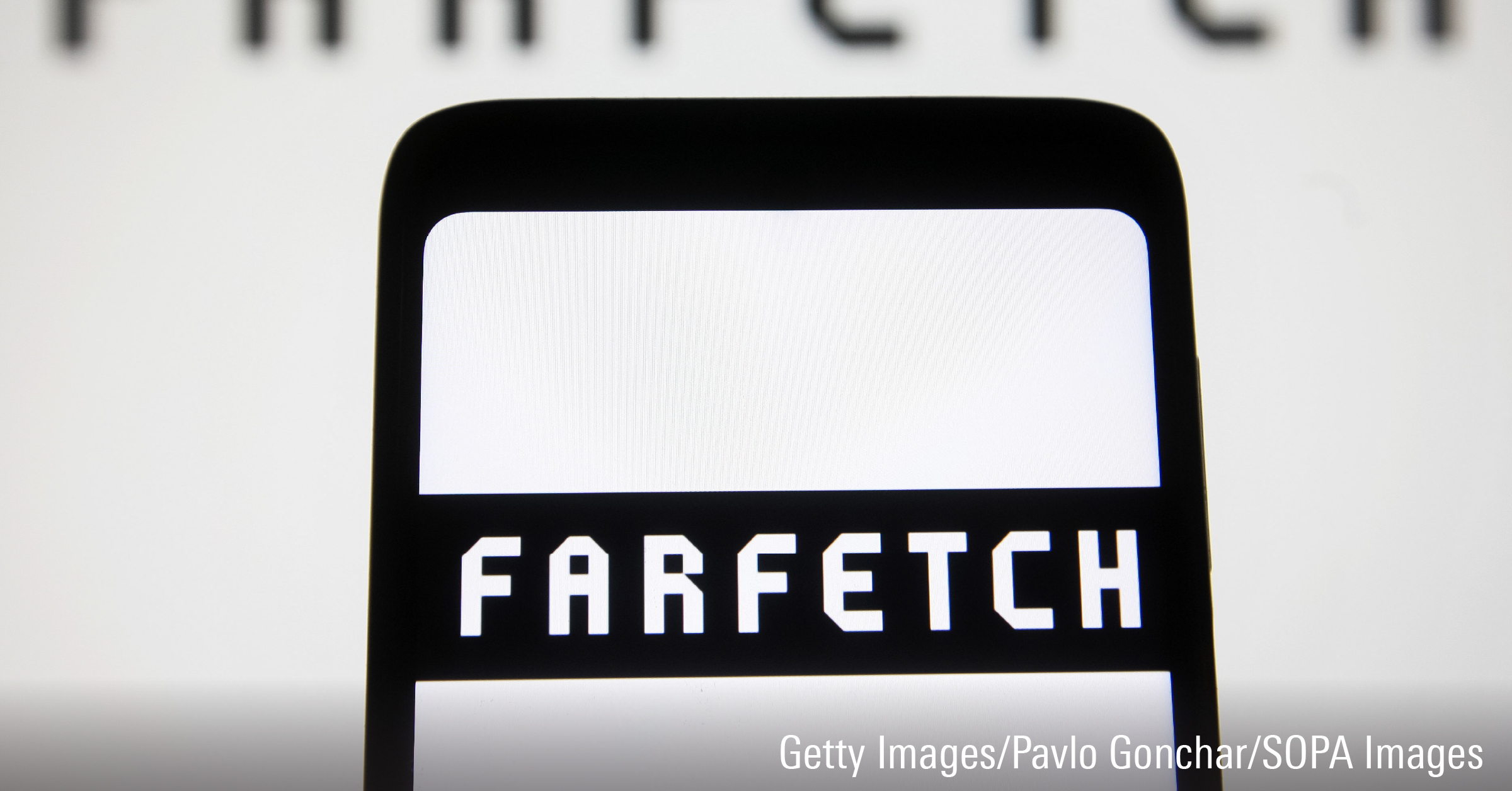 In this photo illustration, the Farfetch logo is displayed on a smartphone screen.
