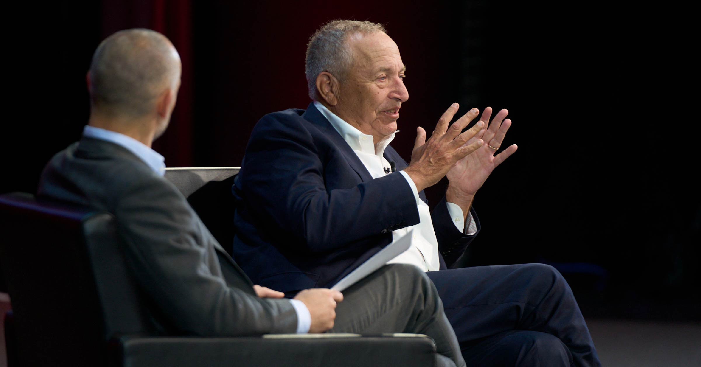 A photo of Lawrence Summers, former US Treasury secretary, and Daniel Needham, the president of  Morningstar Investment Management, on stage at the 2023 Morningstar Investment Conference.