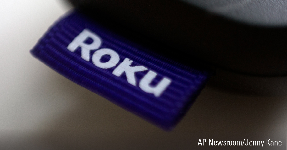 Close-up of Roku logo tag on a remote control.