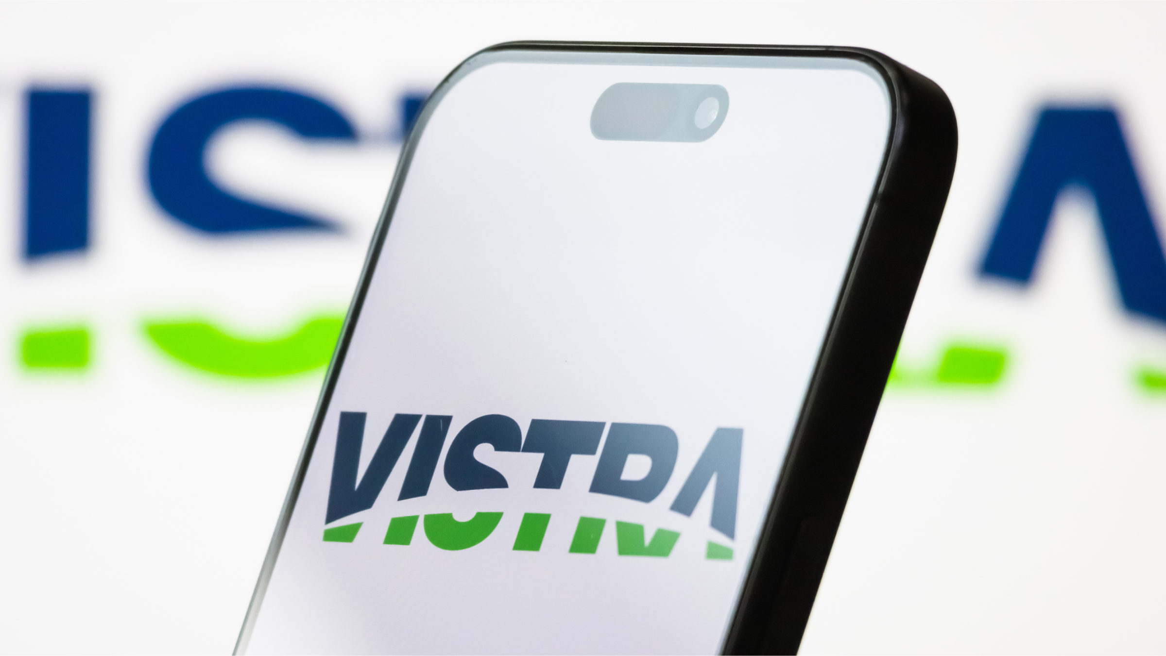 The logo of Vistra Corp. is displayed on a smartphone screen.
