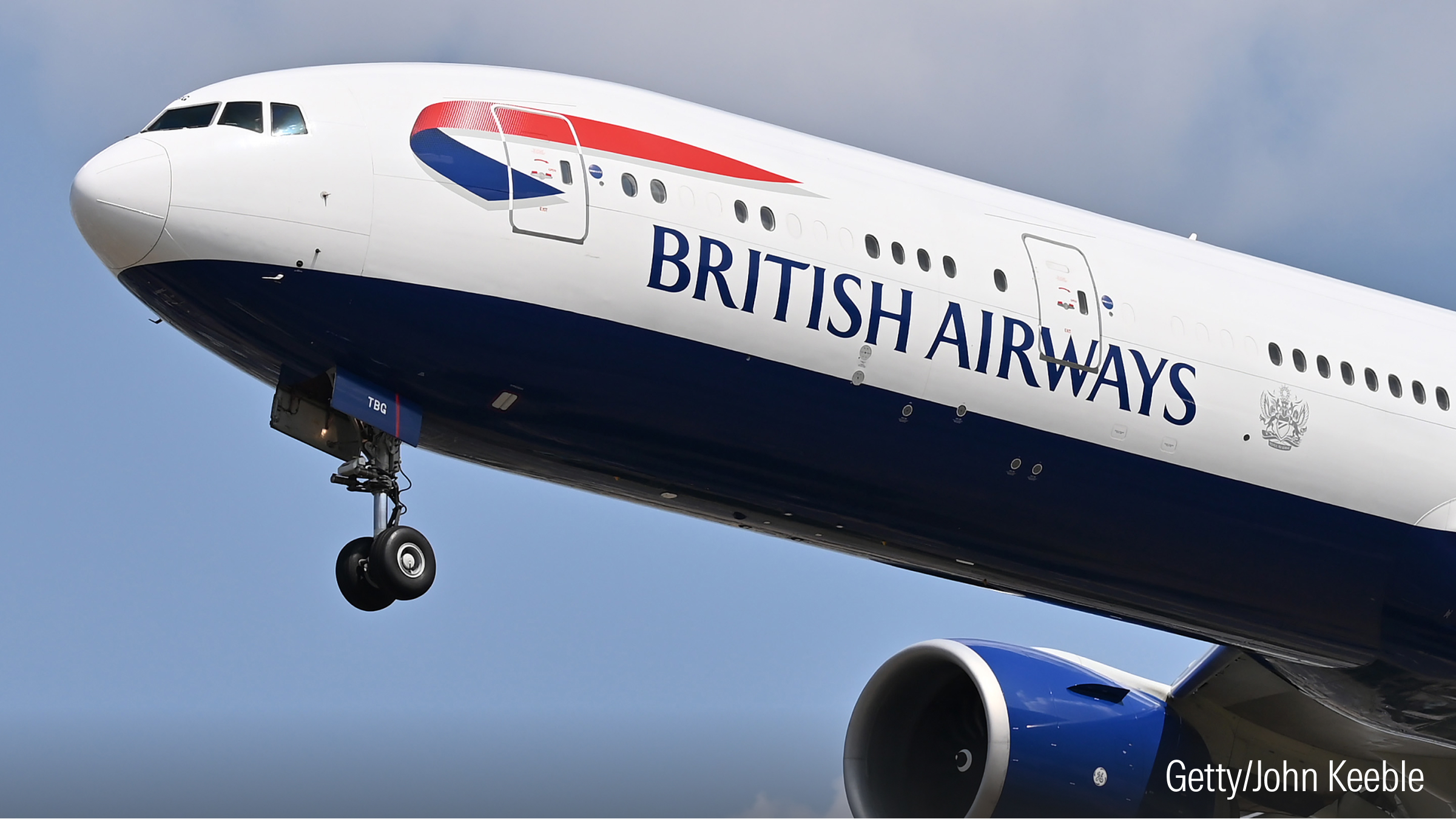 A British Airways plane landing at Heathrow Airport.