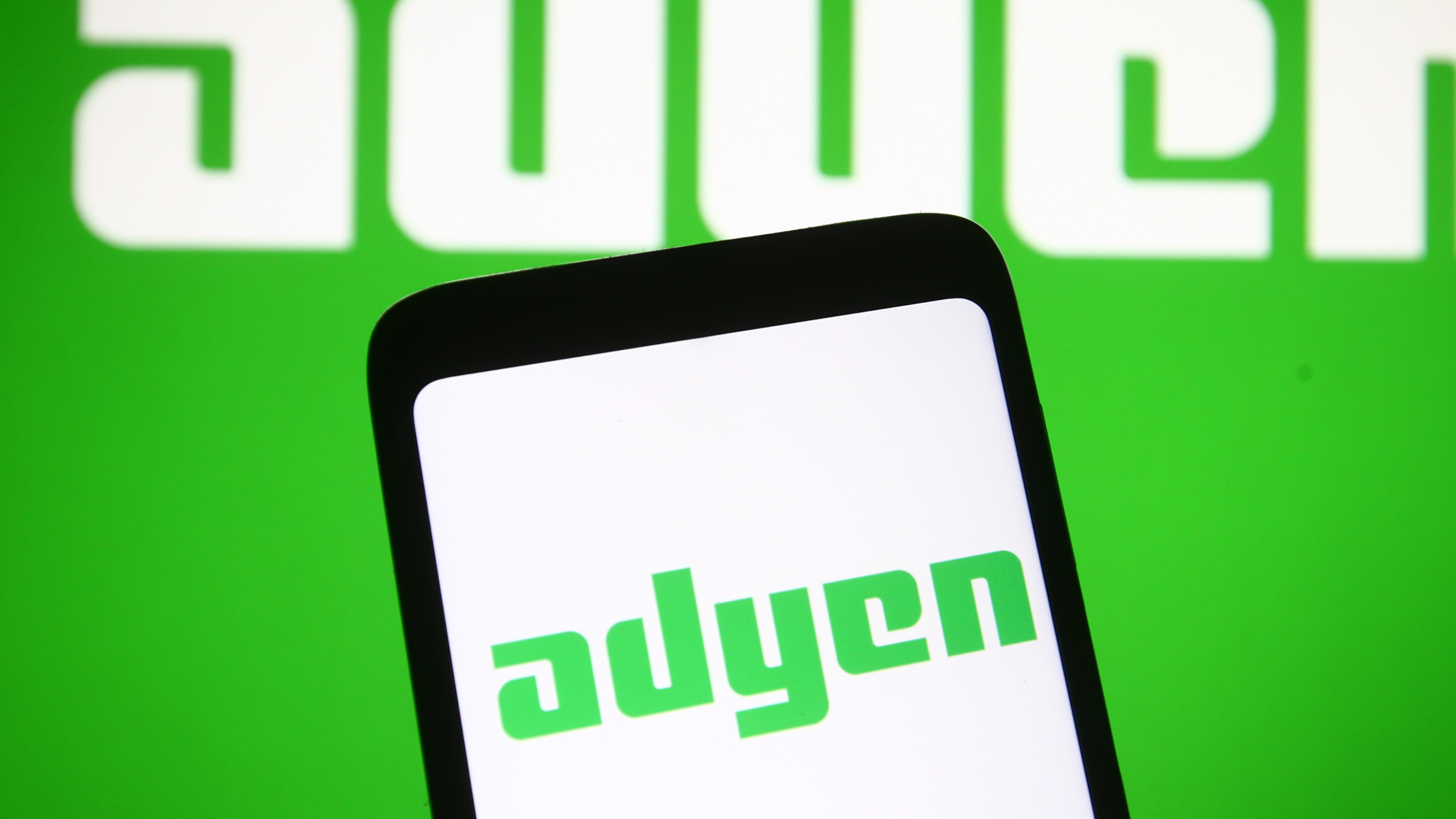 In this photo illustration an Adyen logo of a payment company is seen on a mobile phone screen.