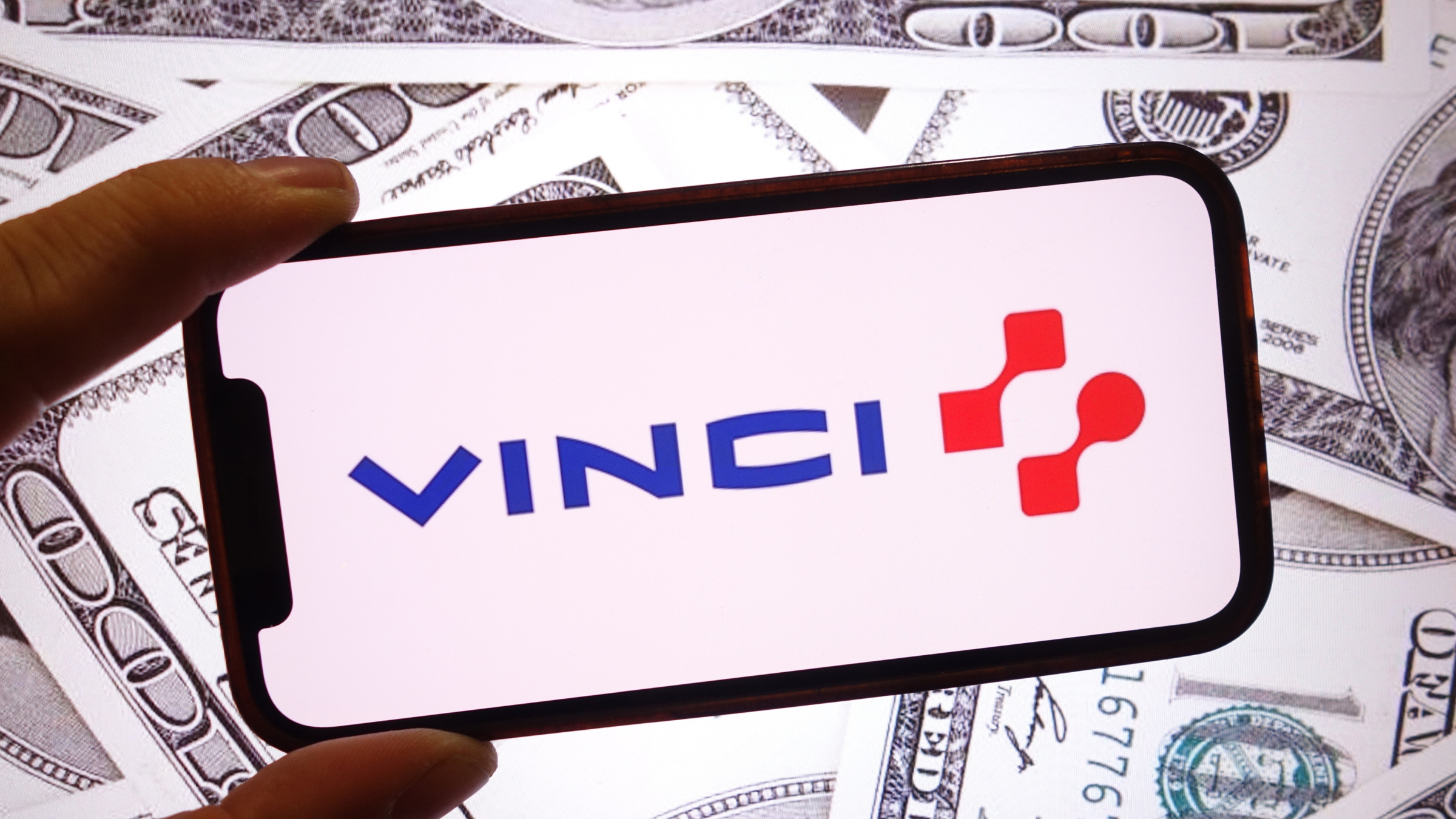 The Vinci company logo is seen displayed on a smartphone screen.