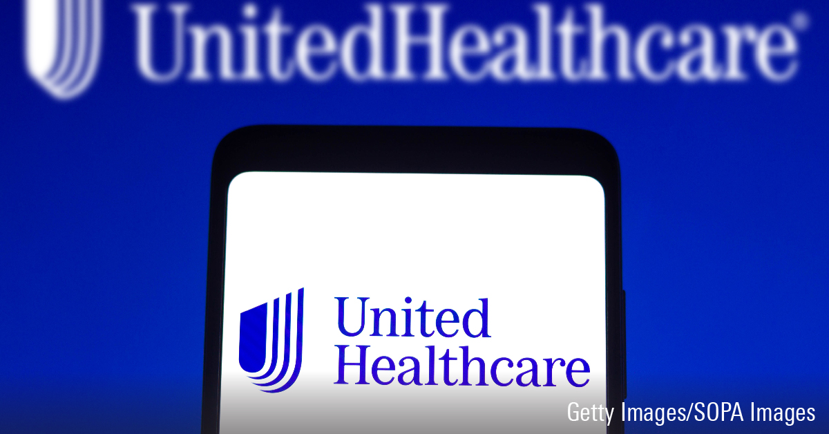 In this photo illustration, the UnitedHealthcare logo seen displayed on a smartphone screen and in the background.
