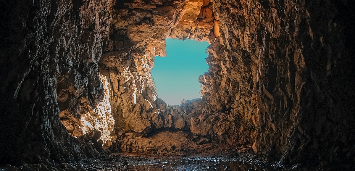 Blue sky at the end of a tunnel