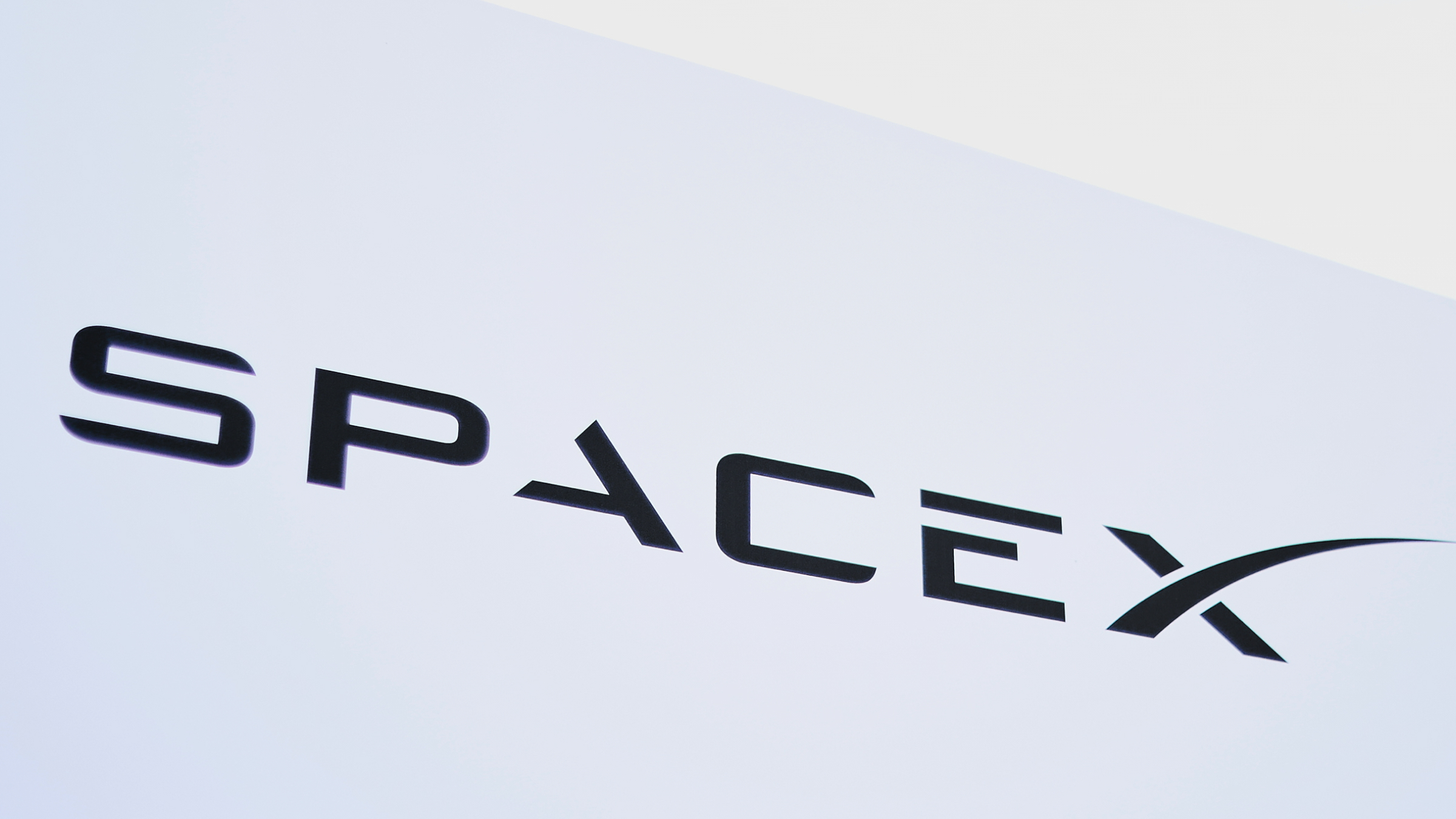 A general view of the SpaceX logo on a sign.