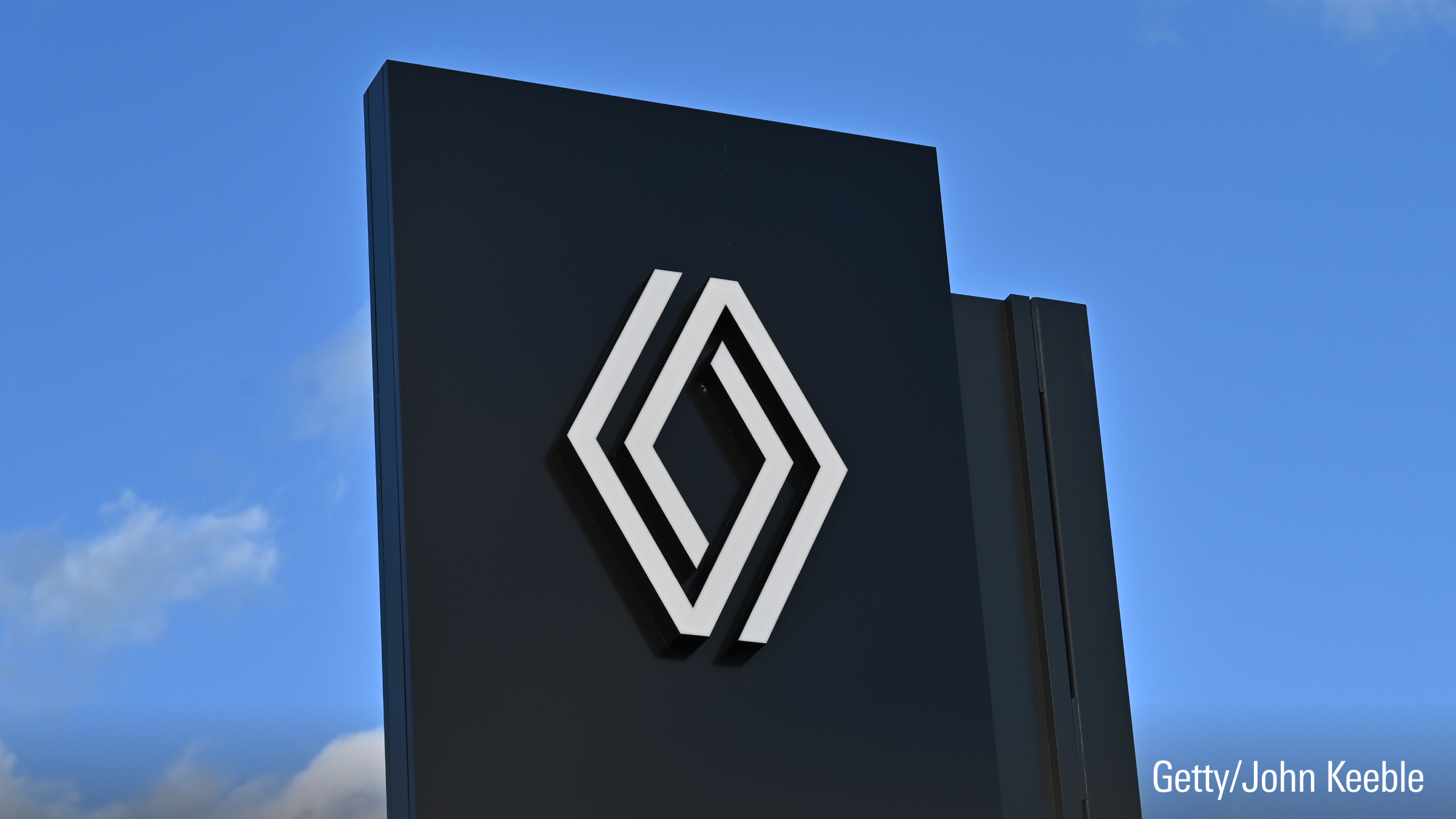 A general view of Renault logo on a dealership showroom sign.