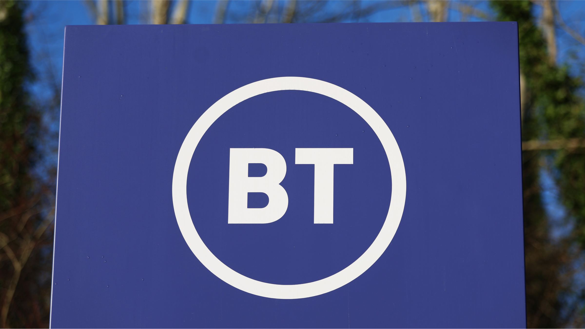 A BT logo is displayed outside the BT - EE Warrington Head Office.