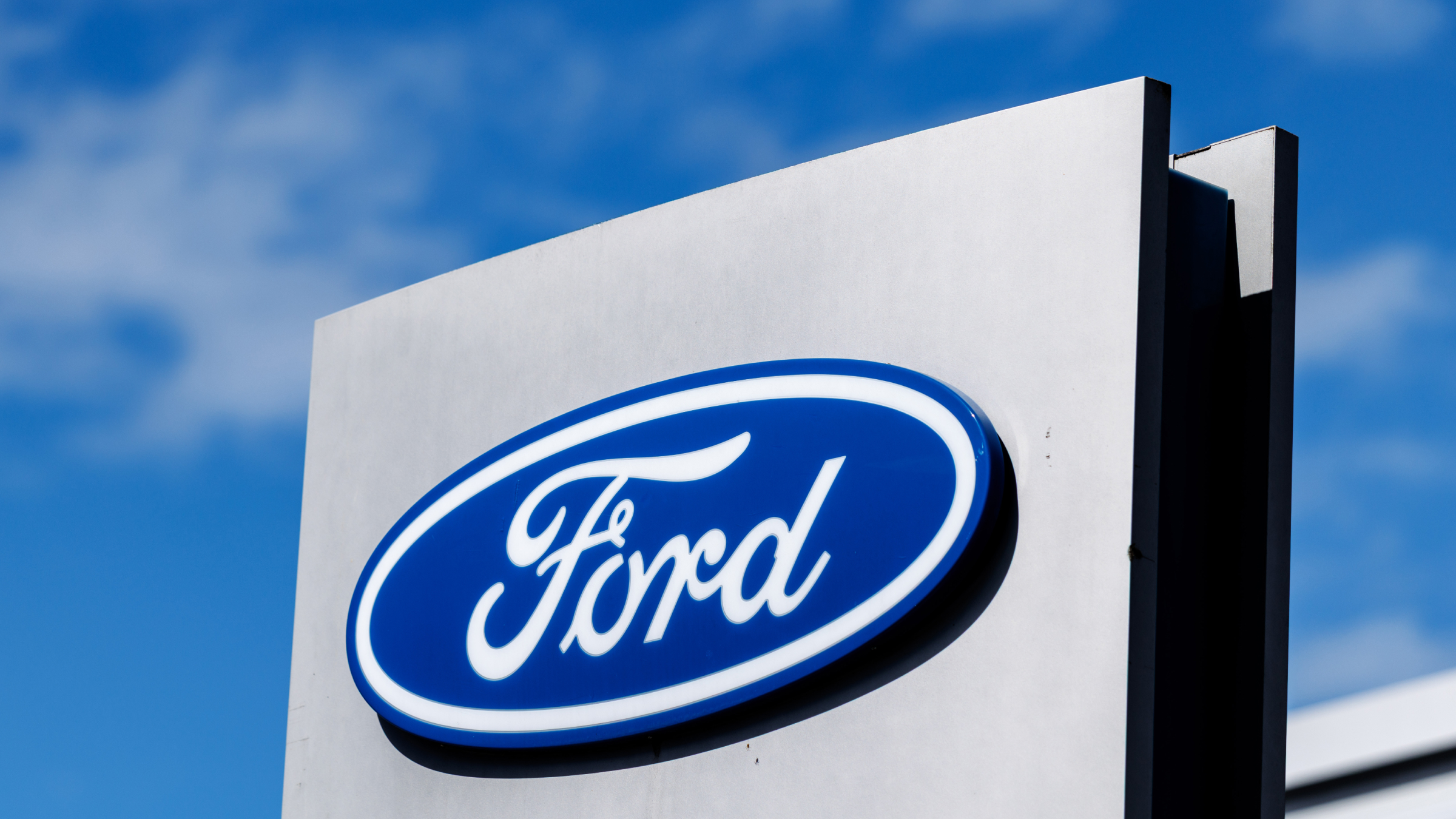 The Ford logo can be seen on a stele in front of a branch of the company.