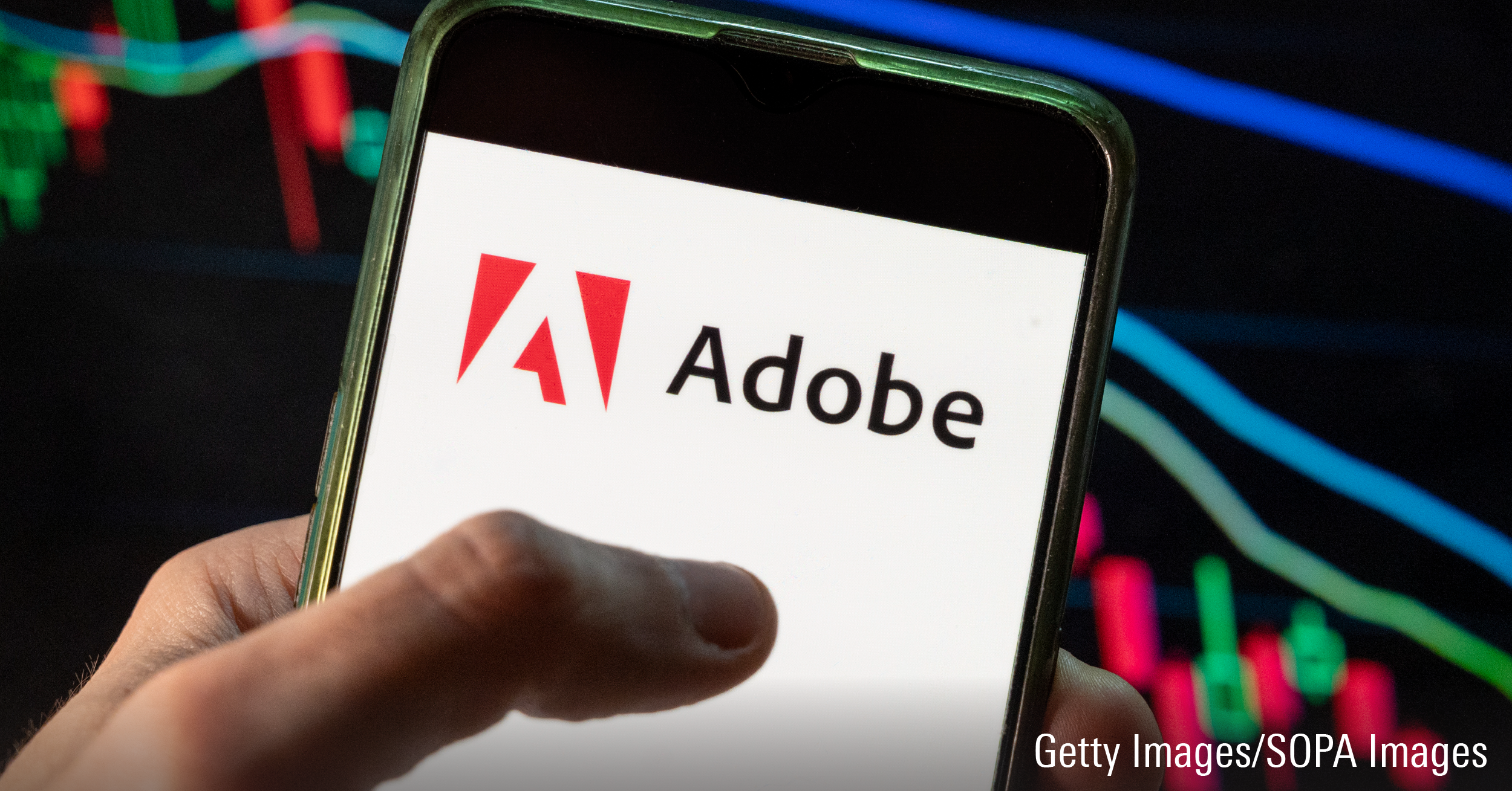 In this photo illustration the American multinational computer multimedia and creativity software company Adobe logo seen displayed on a smartphone with an economic stock exchange index graph in the background.