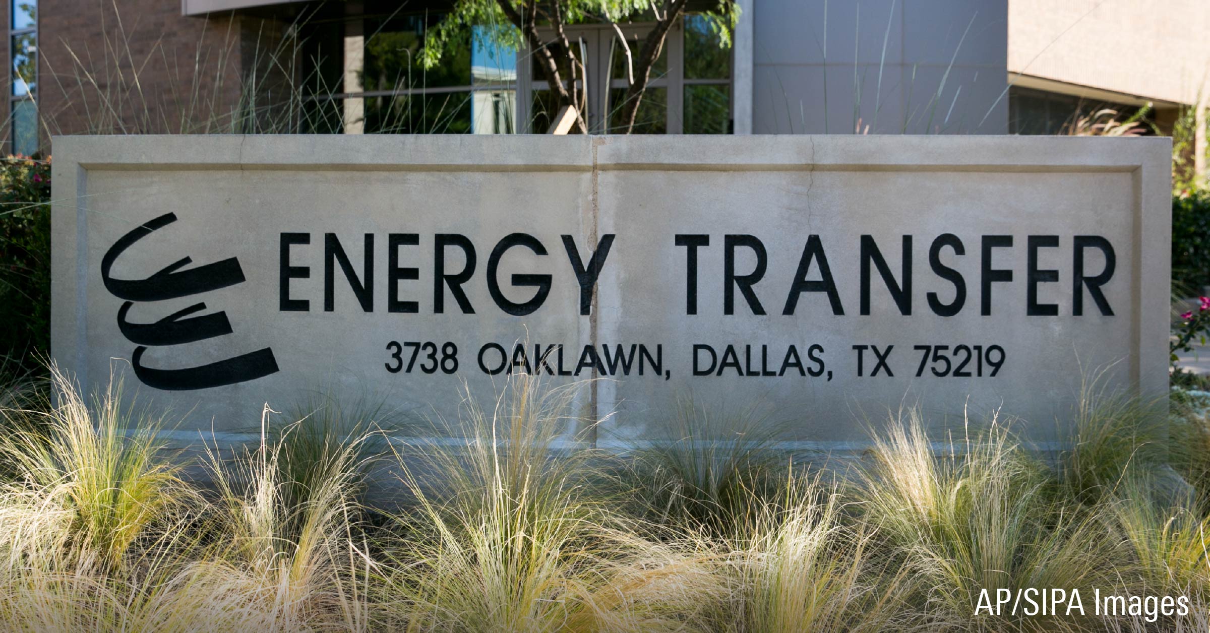 A logo sign outside of the headquarters of Energy Transfer Equity