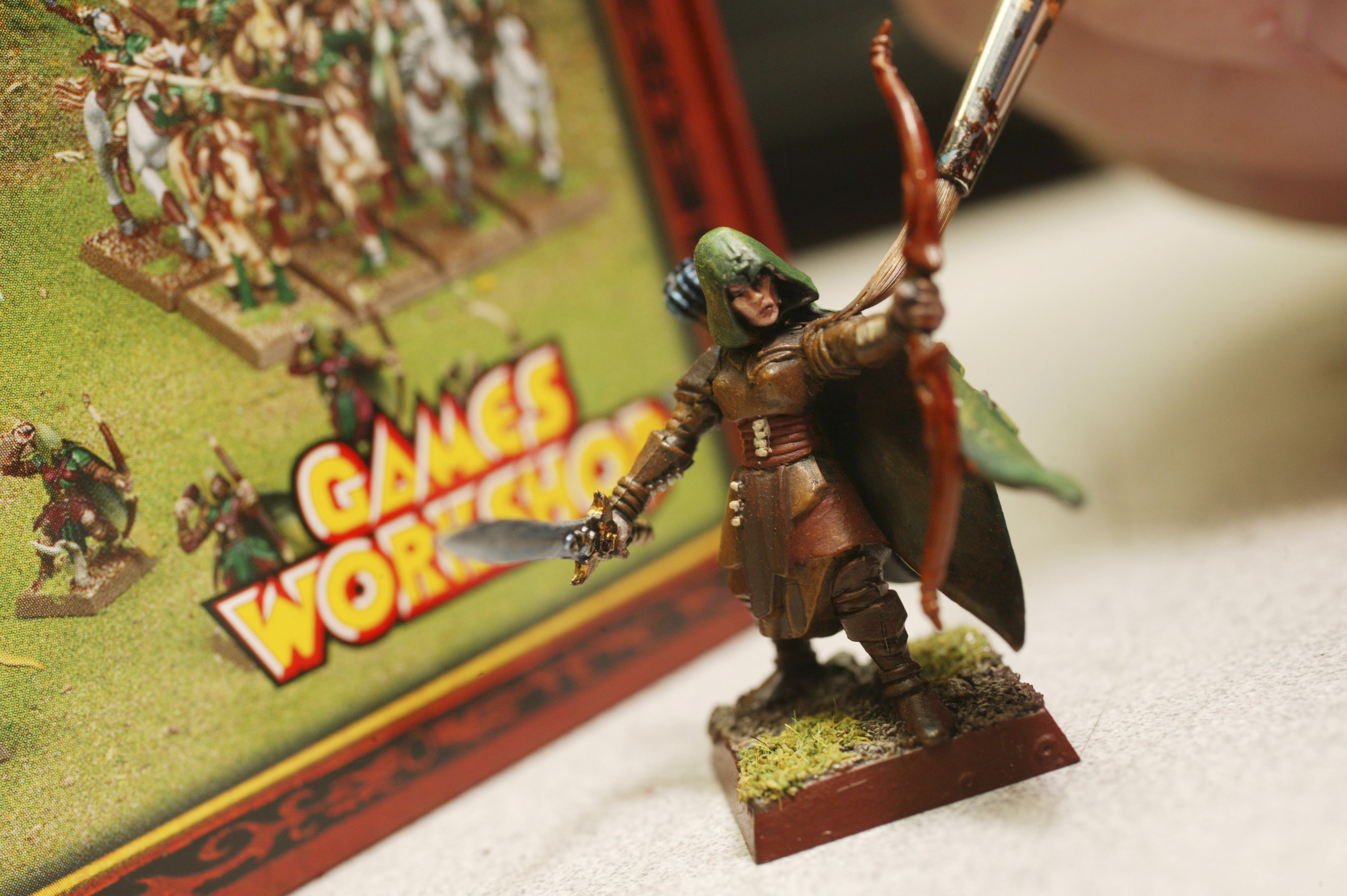 A member of staff paints a figure in a Games Workshop store. (Newscast Limited via AP Images)