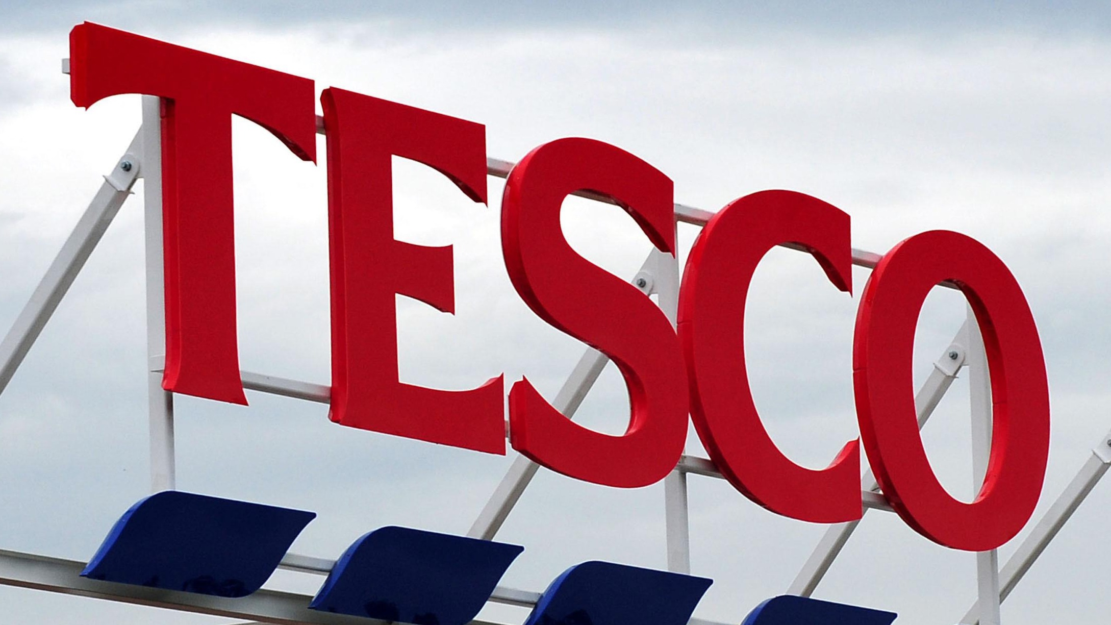 Tesco sales. File photo dated 01/08/12 of a sign for a Tesco store, as the retailer has grown at its fastest rate in three years as more affluent shoppers return to its stores, figures show. Issue date: Tuesday November 15, 2016. Sales at the UK&apos;s biggest supermarket increased by 2.2\% over the quarter to November 6, ahead of overall sales which increased by 0.8\% year-on-year for the second consecutive month, according to Kantar Worldpanel. See PA story CONSUMER Supermarkets.