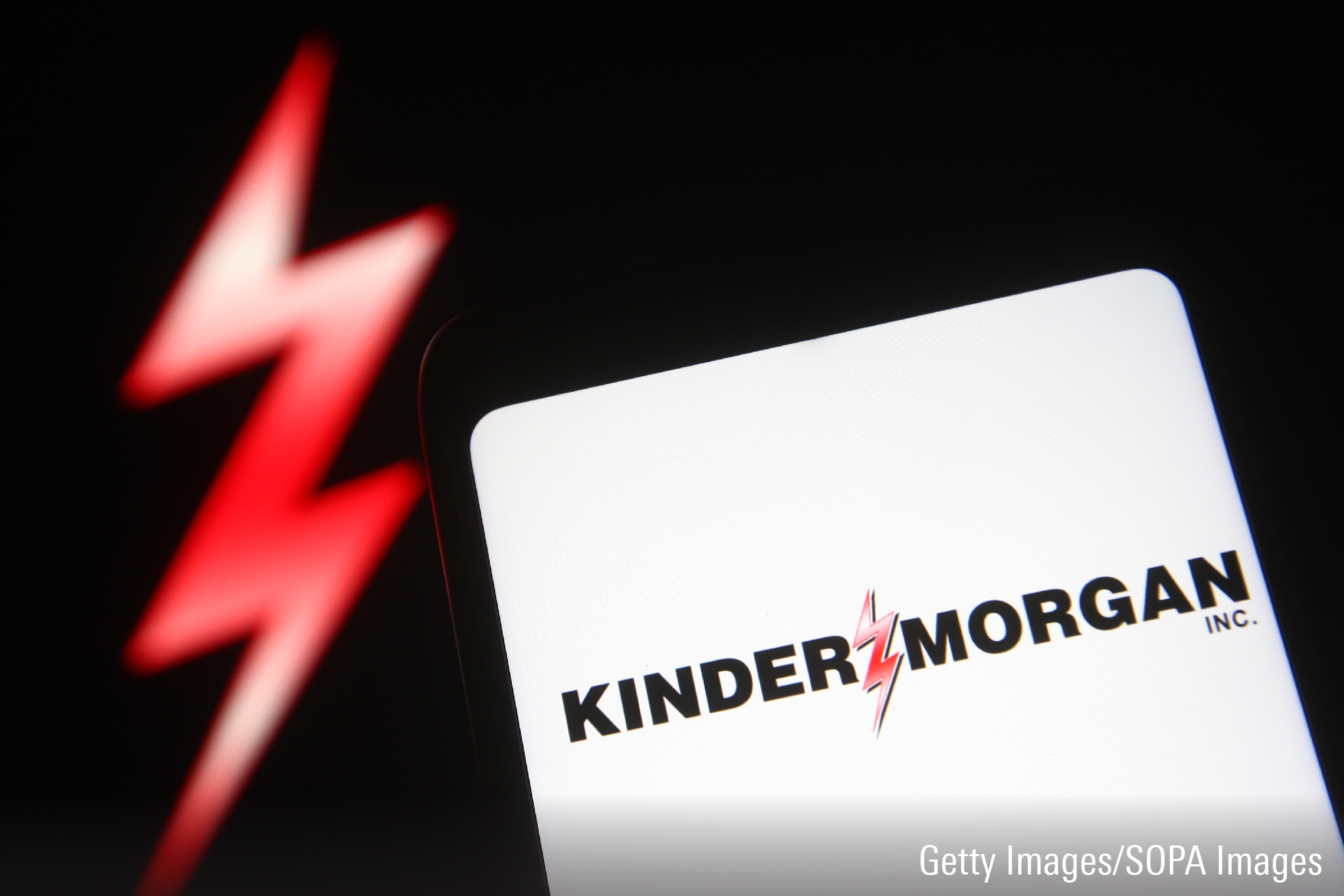 In this photo illustration a Kinder Morgan logo is seen on a smartphone screen.