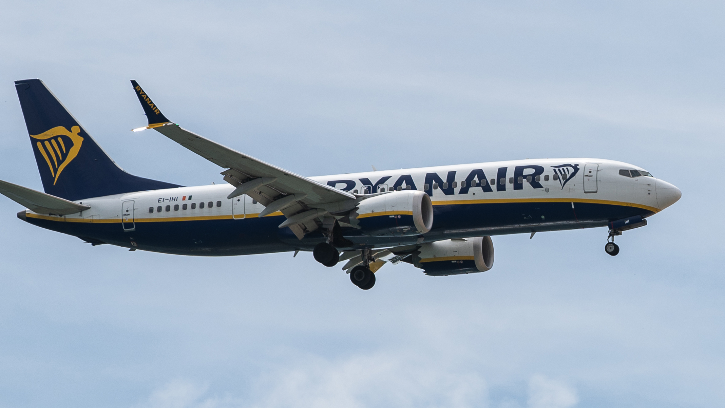 A commercial flight of Ryanair approaching airport.