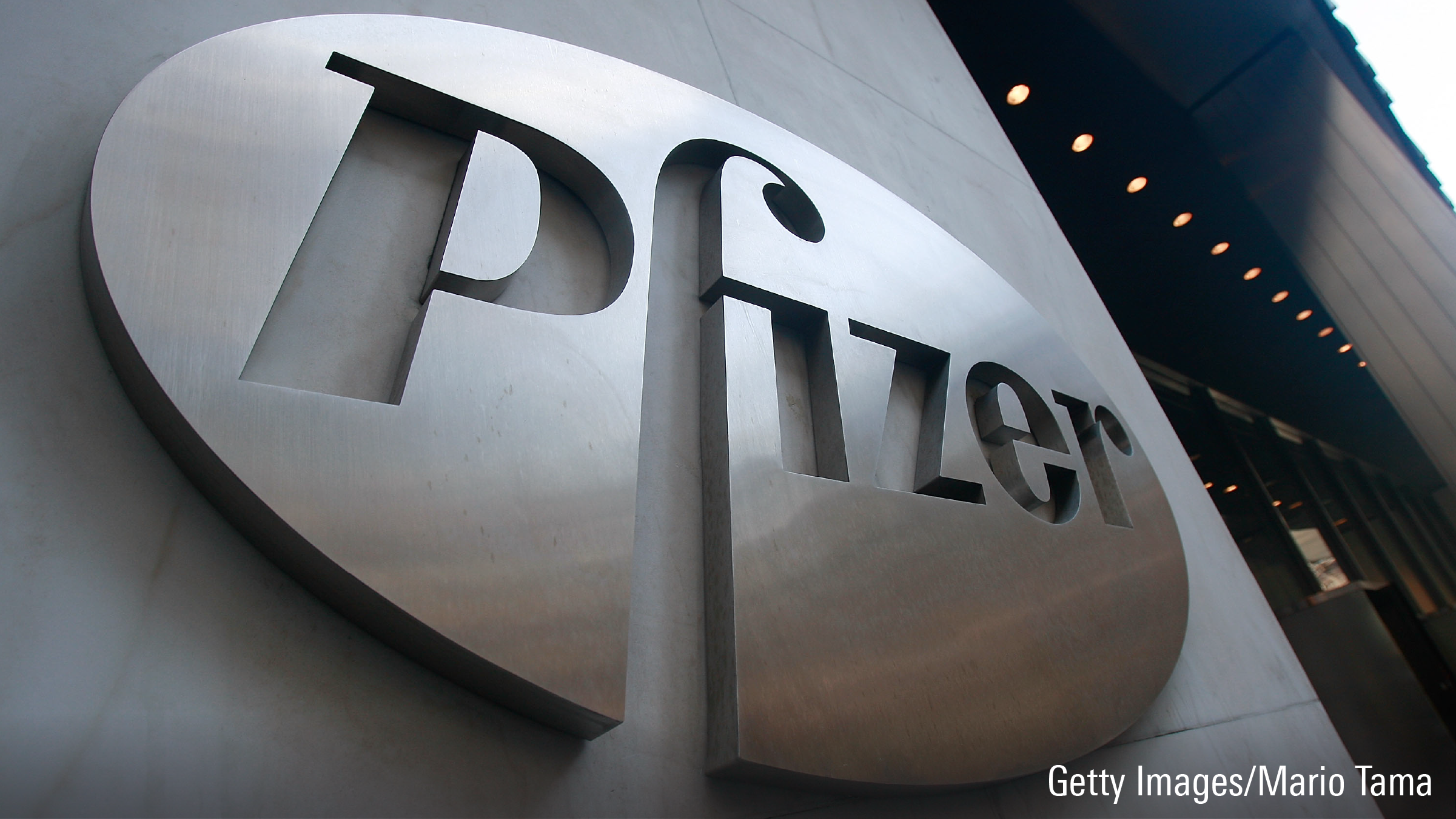 A Pfizer sign hangs outside of their headquarters.