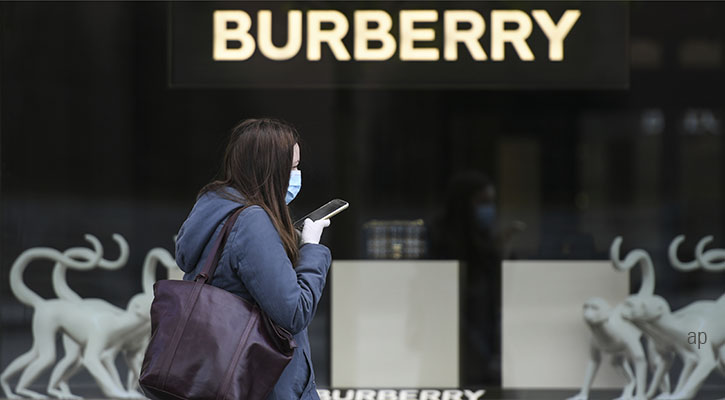 Person outside burberry storefront