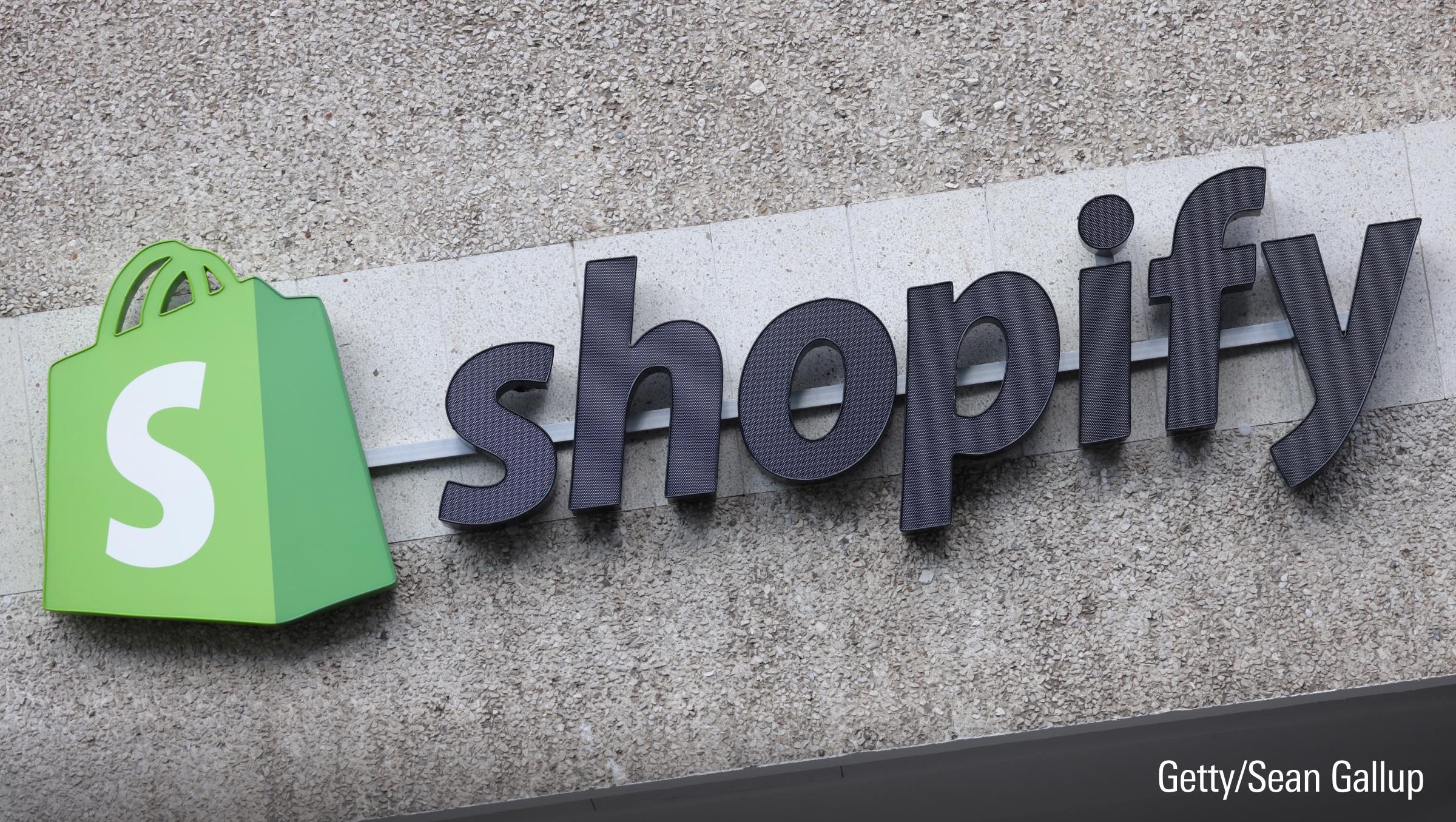 The corporate logo of e-commerce company Shopify hangs at the building.