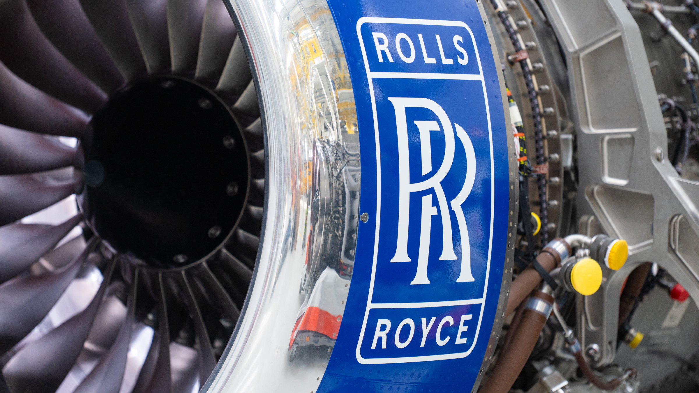 An engine bearing the Rolls-Royce logo stands in a hall at the Rolls-Royce plant in Dahlewitz.