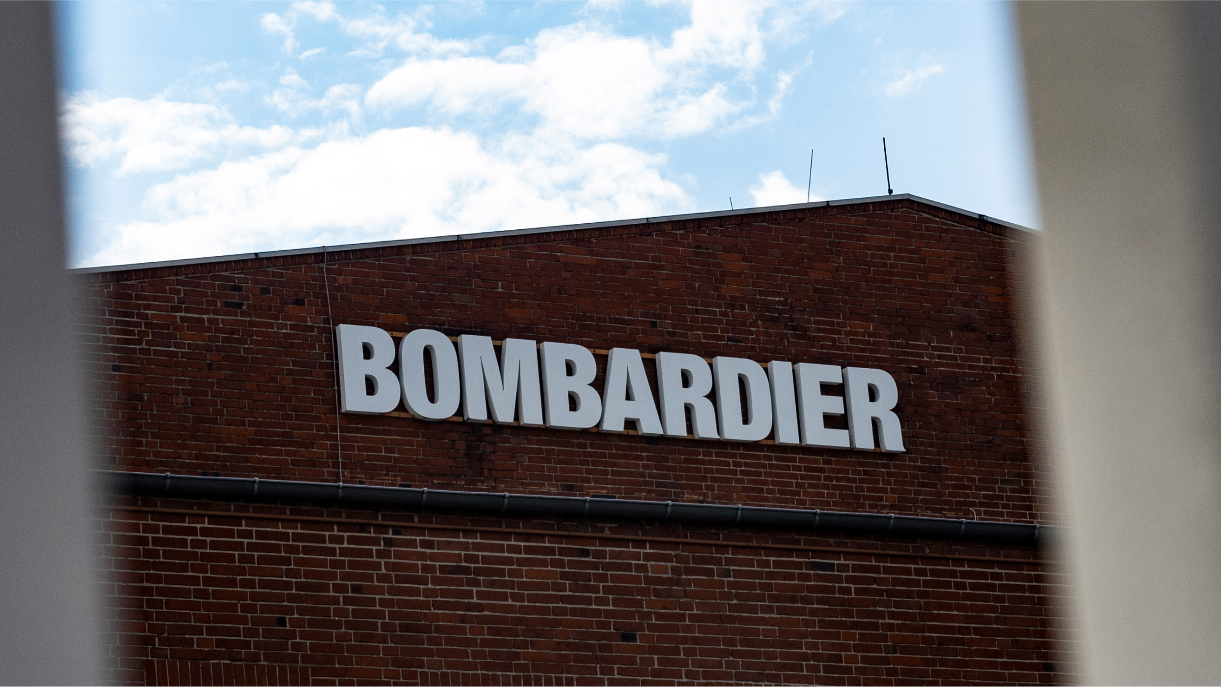 Bombardier stands on the facade of the building.