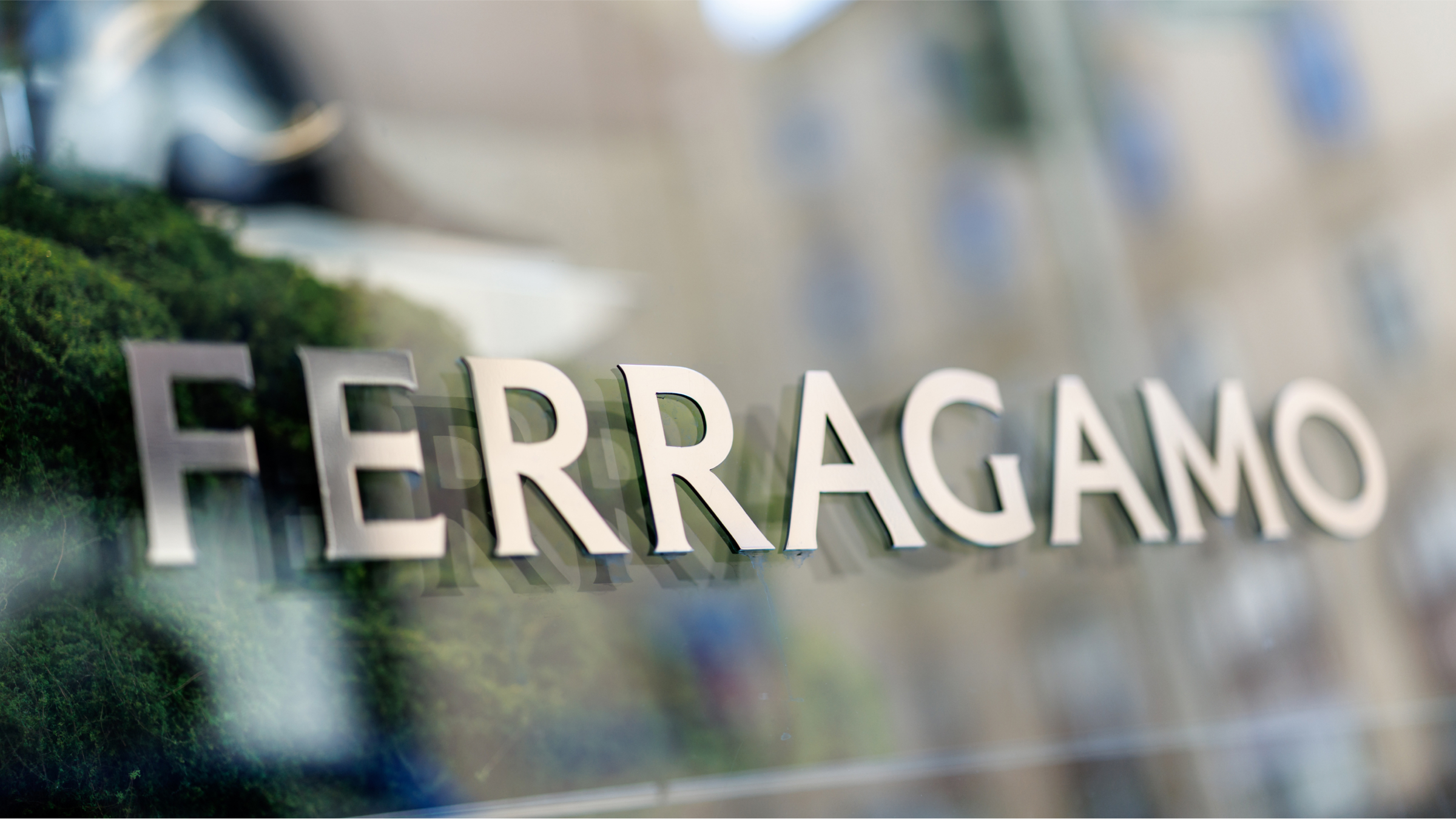 The Ferragamo brand logo is seen of a building exterior.