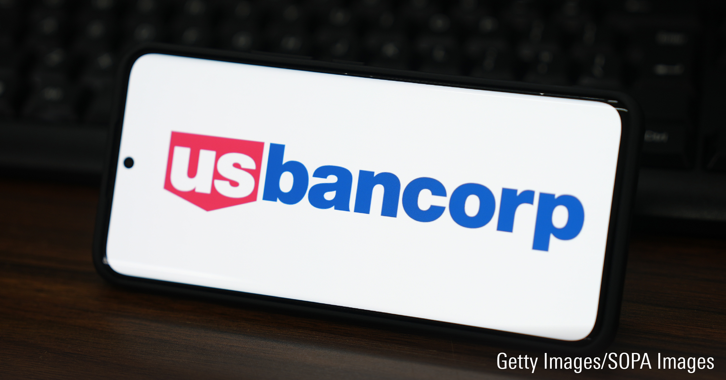 In this photo illustration, the U.S. Bancorp logo is displayed on the screen of a smartphone.